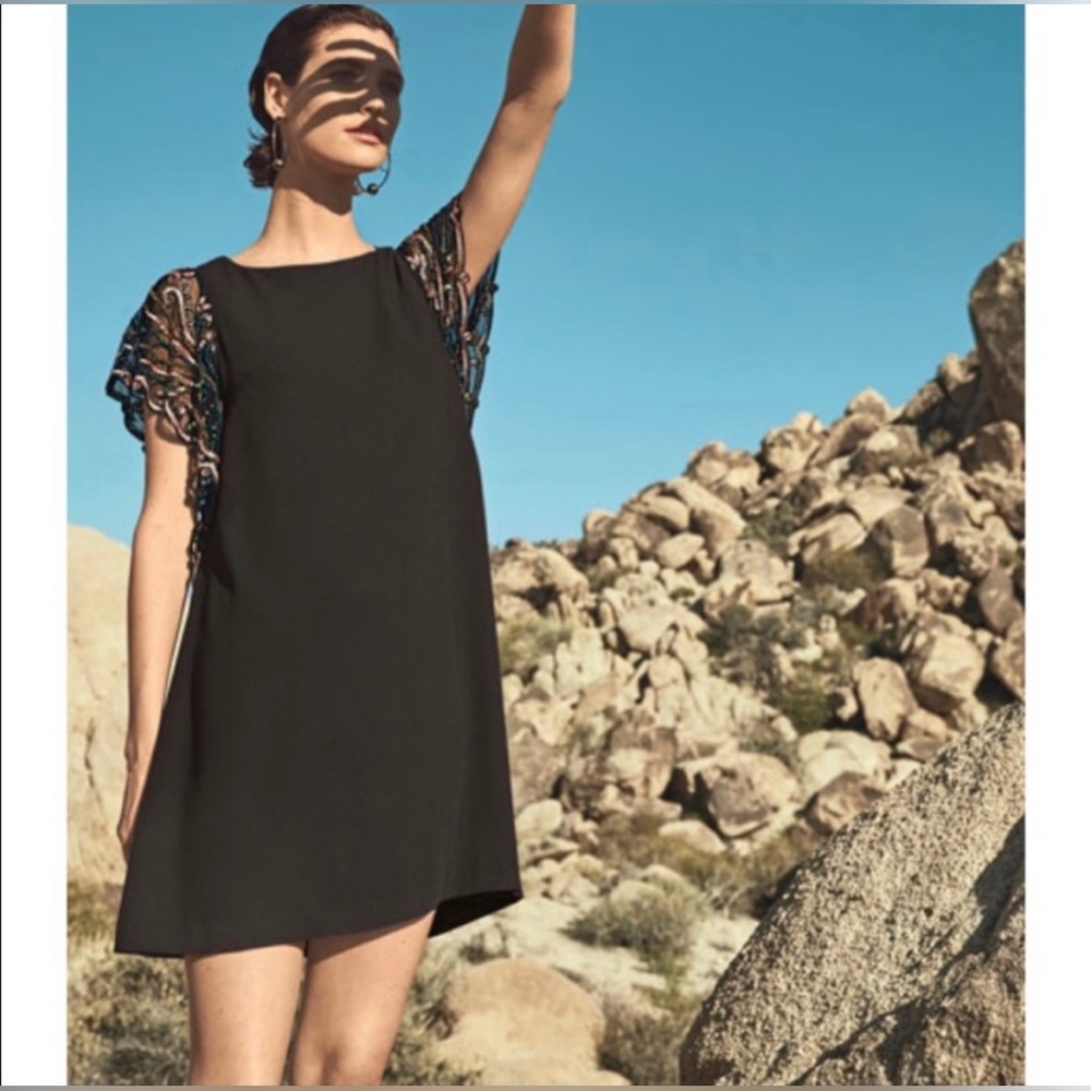 Aidan Mattox Black Trapeze Cocktail Dress with beaded sleeves.